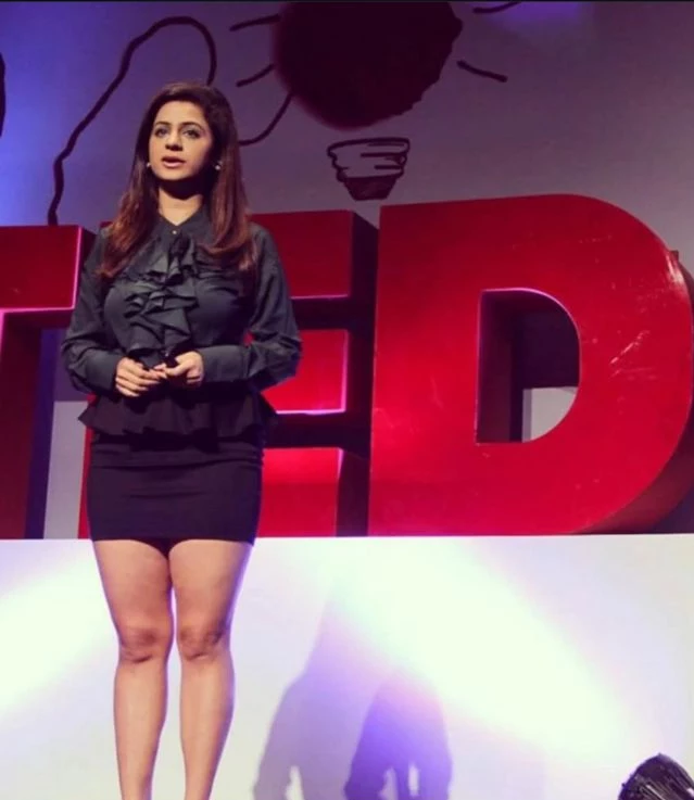 Kenisha Awasthi speaking on stage